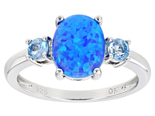 Photo of 9x7mm Oval Lab Created Blue Opal With 0.14ctw Swiss Blue Topaz Rhodium Over Silver Ring - Size 8