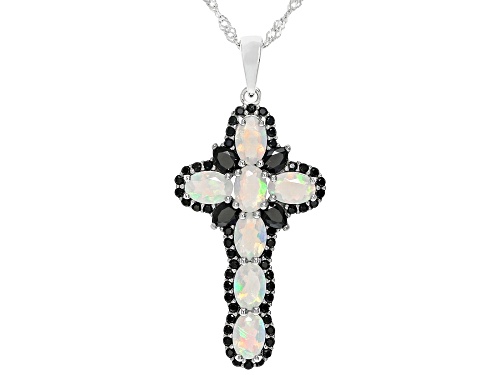 1.76ctw Oval Ethiopian Opal With .90ctw Black Spinel Rhodium Over Silver Cross Pendant With Chain