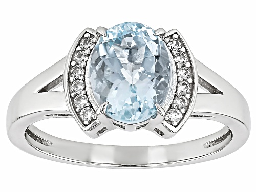 1.31ct Oval Aquamarine With 0.14ctw Round White Zircon Rhodium Over Sterling Silver Ring - Size 7