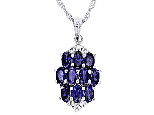 1.80ctw Oval Iolite With 0.28ctw Round White Zircon Rhodium Over Sterling Silver Ring.