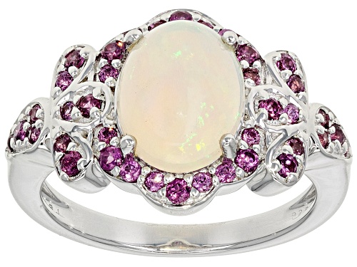 1.39ct Oval Ethiopian Opal With 0.53ctw Round Magenta Rhodolite Rhodium Over Silver Ring - Size 7