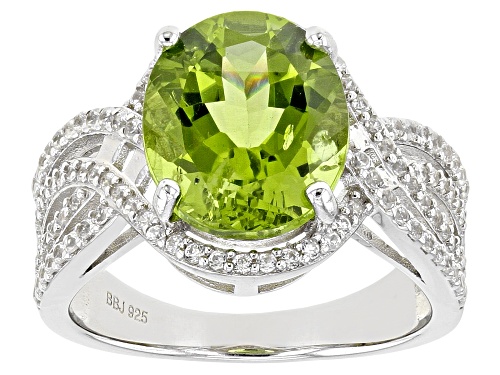 4.50ct Oval Manchurian Peridot™ With 0.57ctw Round White Zircon Rhodium Over Silver Ring - Size 6