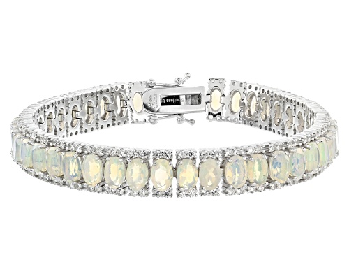 Photo of 9.50ctw Oval Ethiopian Opal With 3.25ctw Round White Zircon Rhodium Over Sterling Silver Bracelet - Size 7