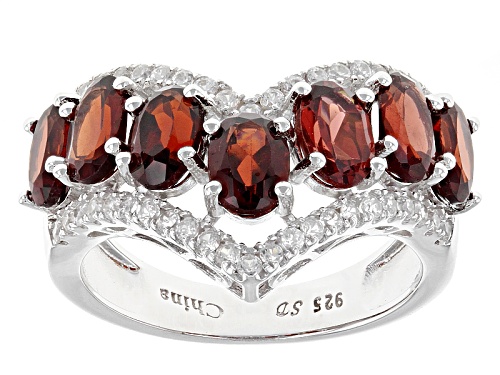 3.50ctw Oval Red Garnet With .67ctw Round White Zircon Rhodium Over Sterling Silver Chevron Ring - Size 7