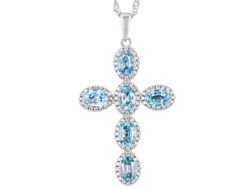 4.65ctw Blue Zircon With .95ctw White Zircon Rhodium Over Sterling Silver Cross Pendant With Chain