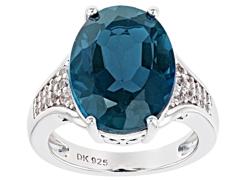 Photo of 10.91ct Oval London Blue Topaz With .38ctw Round White Zircon Rhodium Over Silver Ring - Size 9