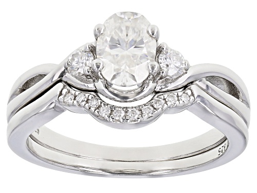 Photo of MOISSANITE FIRE(R) 1.12CTW DEW OVAL AND ROUND PLATINEVE(R) RING WITH BAND - Size 7
