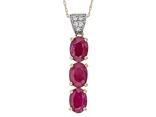 Photo of Pre-Owned 2.16ctw Oval Ruby With .02ctw Round White Zircon 10k Yellow Gold 3 Stone Pendant With Chai
