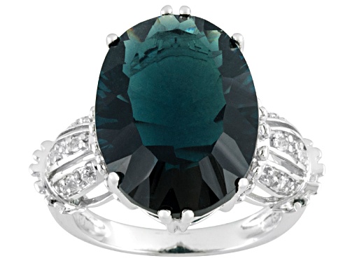 Photo of Pre-Owned 12.32ct Oval Teal Fluorite With .10ctw Round White Topaz Rodium Over Sterling Silver Ring - Size 4