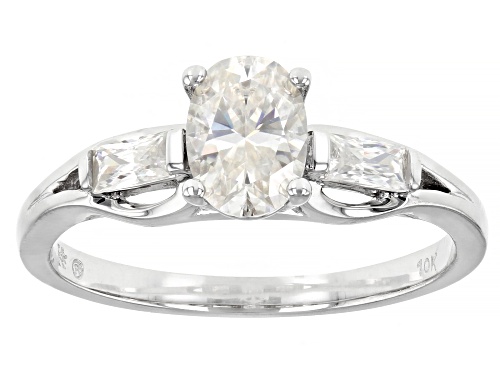 Photo of Pre-Owned MOISSANITE FIRE(R) 1.08CTW DEW OVAL AND BAGUETTE 10K WHITE GOLD RING - Size 7