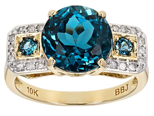 Photo of Pre-Owned 3.95ctw Round London Blue Topaz With .13ctw Round White Diamonds 10k Yellow Gold Ring - Size 6