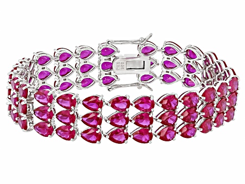 52.79ctw Pear Shape Lab Created Ruby Rhodium Over Sterling Silver Tennis Bracelet - Size 8