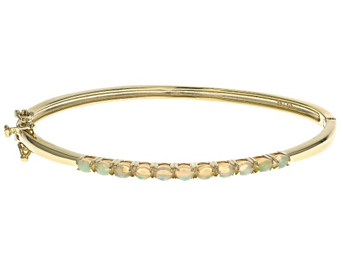 1.03ctw Oval Ethiopian Opal 18k Yellow Gold Over Sterling Silver Bangle Bracelet - Size 7.5