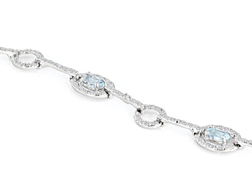 1.62ctw Oval Blue Topaz With 0.01ct Diamond Accent Rhodium Over Sterling Silver Bracelet - Size 7.75