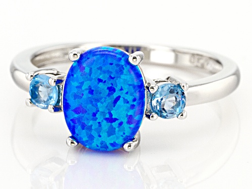 9x7mm Oval Lab Created Blue Opal With 0.14ctw Swiss Blue Topaz Rhodium Over Silver Ring - Size 8
