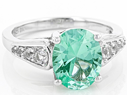 2.30ct Oval Lab Green Spinel With Round 0.19ctw Lab White Sapphire Rhodium Over Silver Ring - Size 8