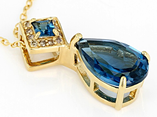 3.23ctw London blue topaz with .05ctw champagne diamond accent 18k gold over silver pendant w/chain