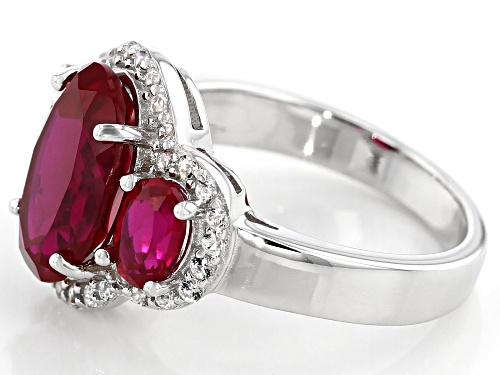 4.76ctw Oval Lab Created Ruby With .38ctw White Topaz Rhodium Over Sterling Silver Ring - Size 9