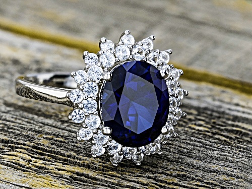 3.74ct Oval Lab Created Blue Sapphire & 1.03ctw Lab Created White Sapphire Rhodium Over Silver Ring - Size 9
