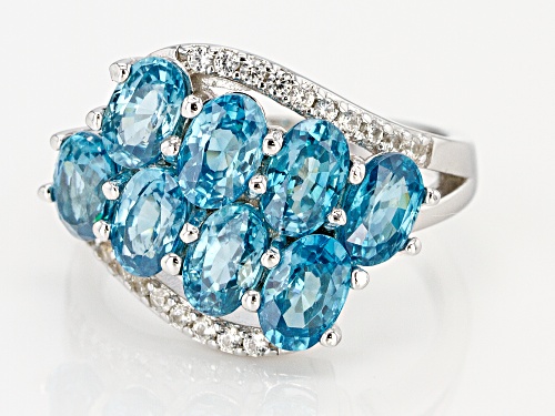 5.38ctw oval blue and round white zircon rhodium over sterling silver bypass ring - Size 8