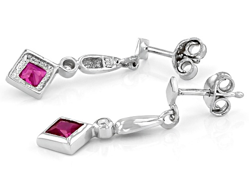 Bella Luce ® 0.90ctw Lab Created Ruby And White Diamond Simulant Rhodium Over Silver Earrings