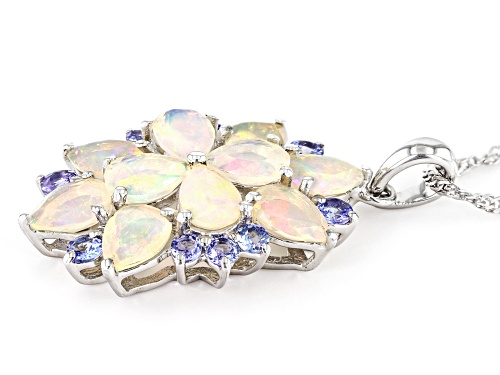 3.57ctw Pear Shape Ethiopian Opal With .74ctw Round Tanzanite Rhodium Over Silver Pendant/Chain
