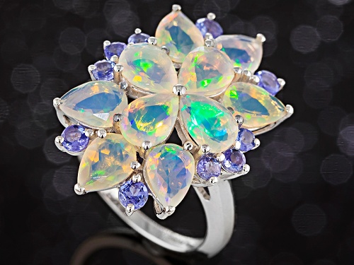 3.57ctw Pear Shape Ethiopian Opal With .74ctw Round Tanzanite Rhodium Over Sterling Silver Ring - Size 5