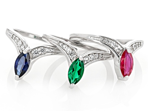 .48ct Lab Emerald, .55ct Lab ruby, .84ctw Lab Blue & Lab White Sapphire Rhodium Over Silver Ring Set - Size 7