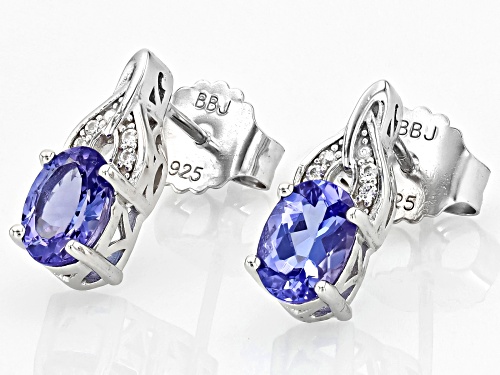 1.29ctw Oval Tanzanite With 0.05ctw Round White Zircon Rhodium Over Sterling Silver Earrings