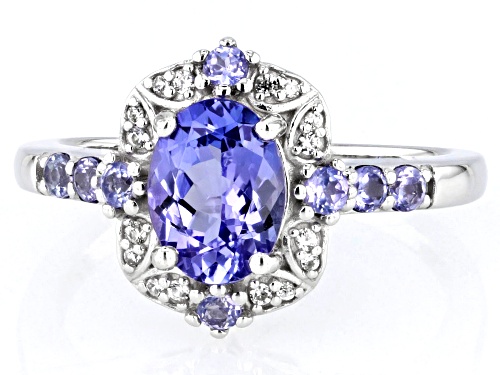 1.10ct Oval And 0.20ctw Round Tanzanite With .06ctw White Zircon Rhodium Over Silver Ring - Size 9