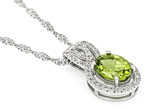 1.73ct Oval Manchurian Peridot™ With .20ctw White Zircon Rhodium Over Silver Pendant With Chain