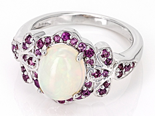 1.39ct Oval Ethiopian Opal With 0.53ctw Round Magenta Rhodolite Rhodium Over Silver Ring - Size 7