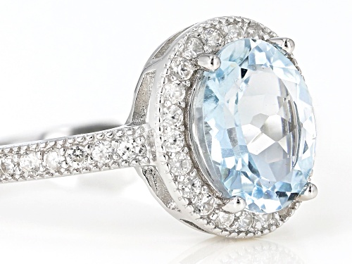 1.40ctw Oval Aquamarine With 0.40ctw Round White Zircon Rhodium Over Sterling Silver Ring - Size 6