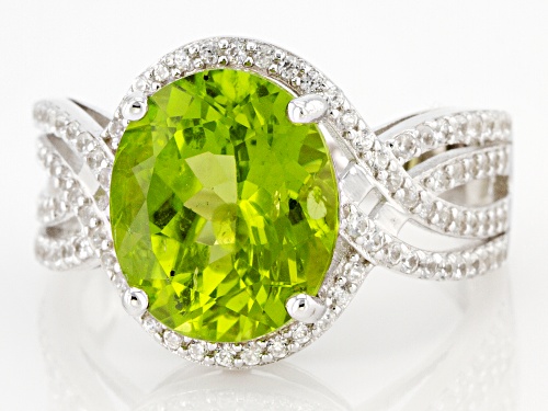 4.50ct Oval Manchurian Peridot™ With 0.57ctw Round White Zircon Rhodium Over Silver Ring - Size 6