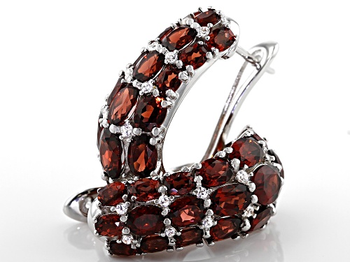 11.00ctw Oval Garnet With 0.50ctw Round White Zircon Rhodium Over Sterling Silver Earrings