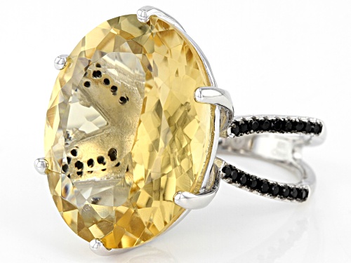 20.00CT OVAL BRAZILIAN CITRINE WITH .78CTW ROUND BLACK SPINEL RHODIUM OVER SILVER RING - Size 7