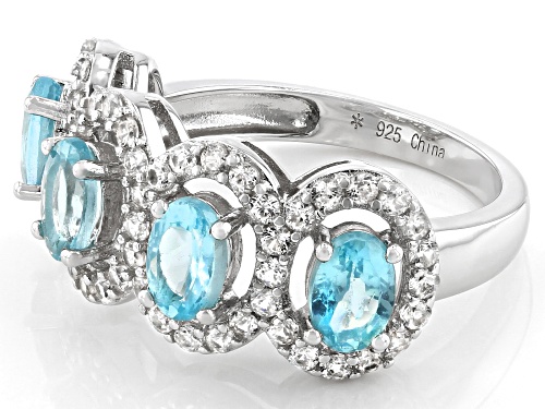 1.70CTW OVAL BLUE APATITE WITH 1.20CTW ROUND WHITE ZIRCON RHODIUM OVER SILVER 4-STONE BAND RING - Size 7