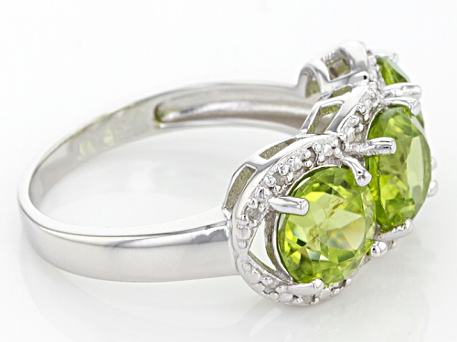 4.00ctw Round Green Peridot With .13ctw Round White Diamond Sterling Silver 3-Stone Ring - Size 11