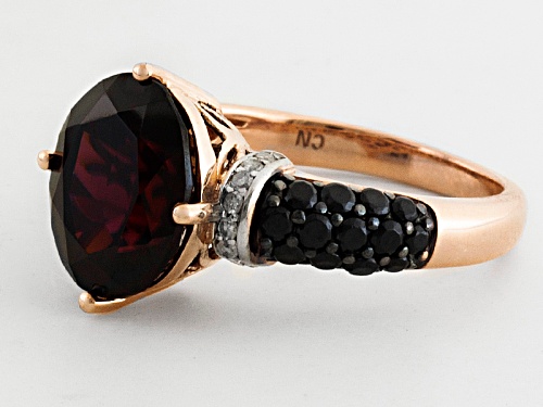 5.00ct Oval Red Zircon With .35ctw Black Spinel And .08ctw White Diamond Accents 10k Rose Gold Ring - Size 12