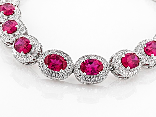 12.50ctw Oval Lab Created Ruby With White Diamond Accent Rhodium Over Sterling Silver Bracelet - Size 8