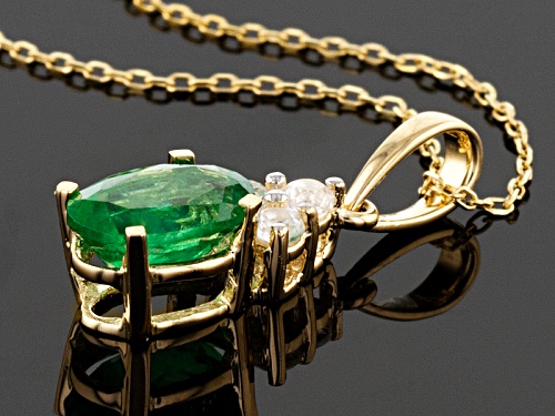 .70ct Oval Emerald Color Apatite With .12ctw Round White Zircon 10k Yellow Gold Pendant With Chain.