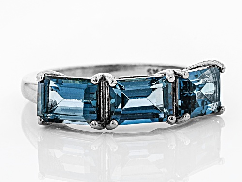 3.09ctw Emerald Cut London Blue Topaz Rhodium Over Sterling Silver 3-Stone Ring - Size 8