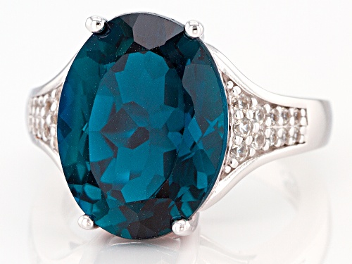 10.91ct Oval London Blue Topaz With .38ctw Round White Zircon Rhodium Over Silver Ring - Size 8