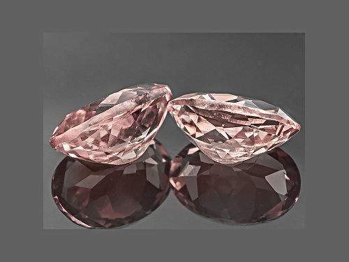Matched pair of color shift Masasi Bordeaux Garnet™ min 1.00ctw 6x4mm oval