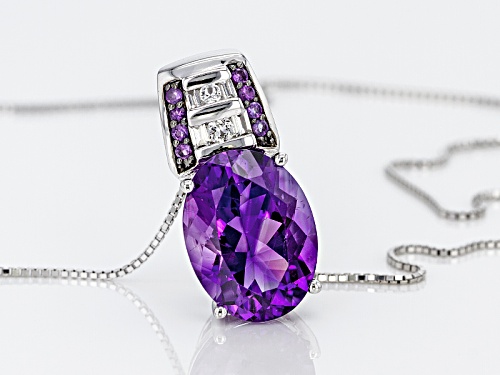 7.12ct Oval and .12ctw Moroccan Amethyst With .27ctw Topaz Silver Pendant With Chain
