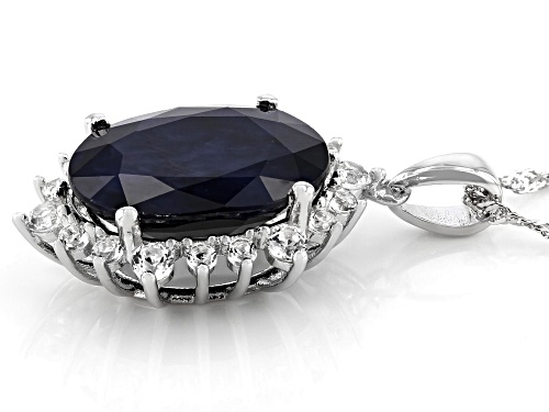 7.40ct Oval Sapphire and .79ctw White Topaz Rhodium Over Sterling Silver Halo Pendant With Chain