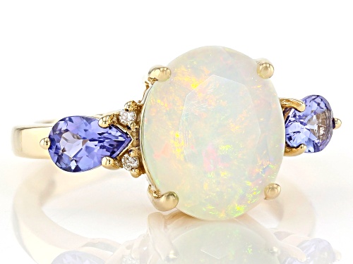 2.25ct Oval Ethiopian Opal With 0.65ctw Tanzanite And 0.03ctw Diamond Accent 10K Yellow Gold Ring - Size 7