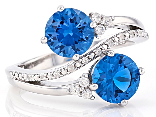 2.52ctw Round Lab Created Blue Spinel With .23ctw Zircon Rhodium Over Silver Bypass Ring - Size 9