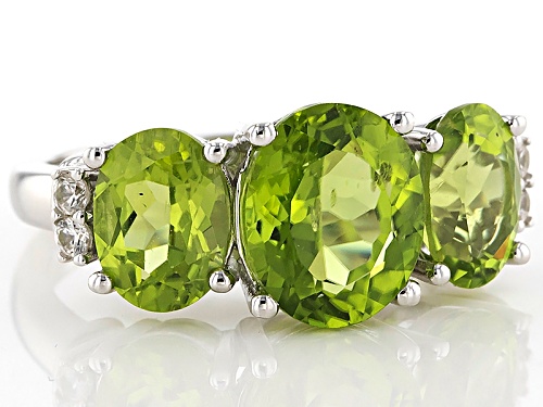4.60ctw Oval Manchurian Peridot™ With .11ctw Round White Zircon Sterling Silver 3-Stone Ring - Size 5