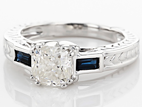 Moissanite Fire® 1.30ct Dew Cushion Cut With .34ctw Baguette Blue Sapphire Platineve™ Ring - Size 9
